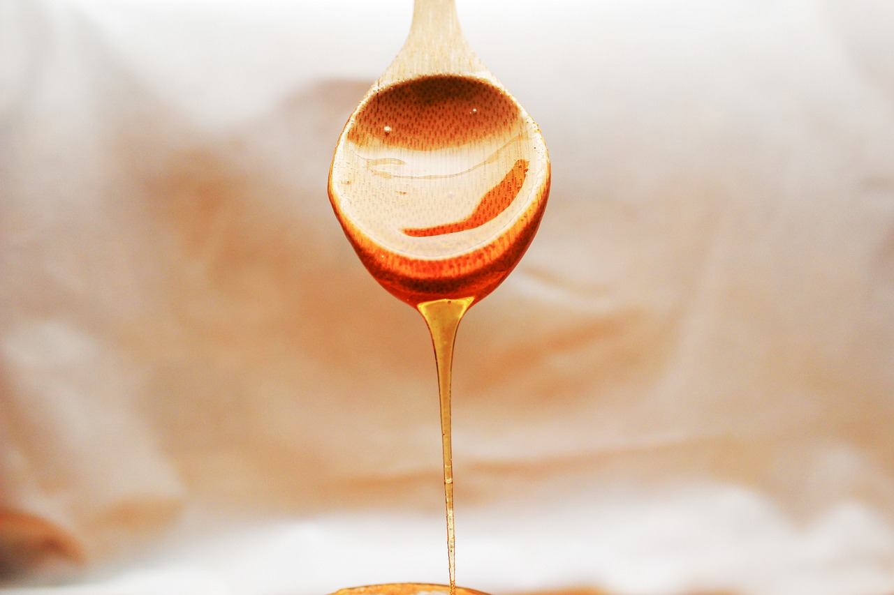 honey flowing spoon free photo
