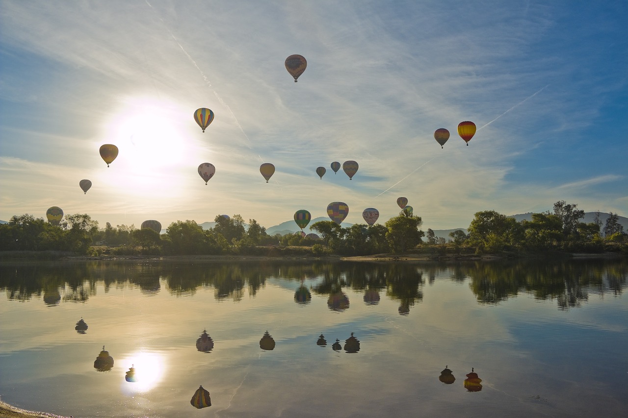 hot air balloon balloon and wine festival floating over lake free photo