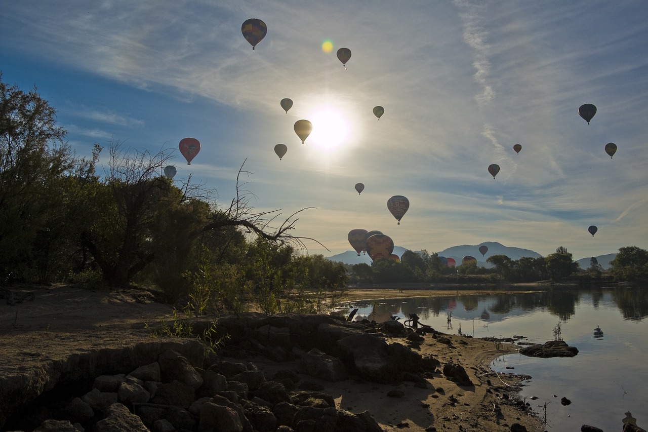 hot air balloon balloon and wine festival floating over lake free photo