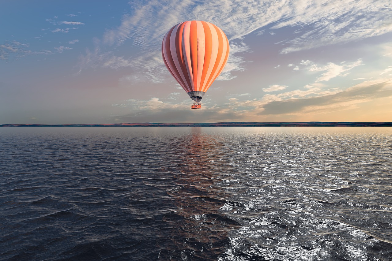 hot air balloon  water  reflection free photo