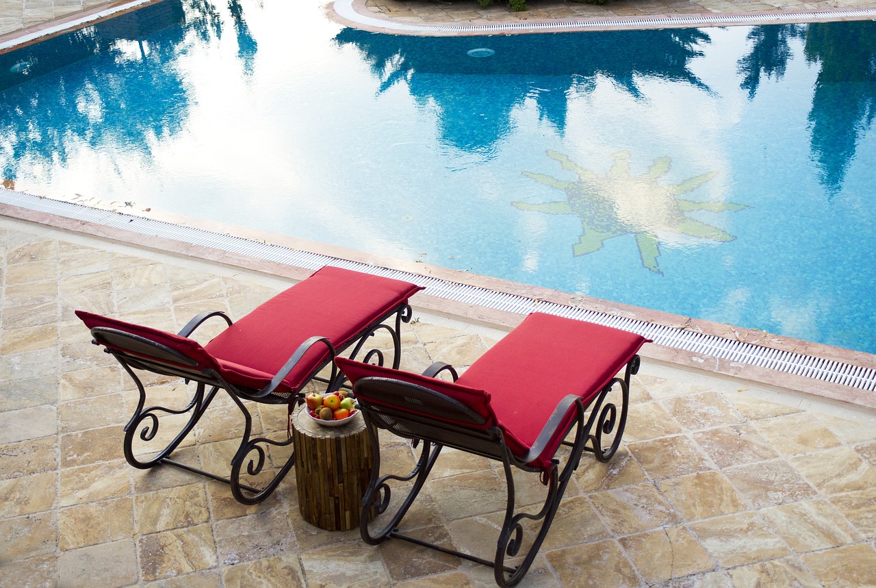 hotel pool sunbeds free photo