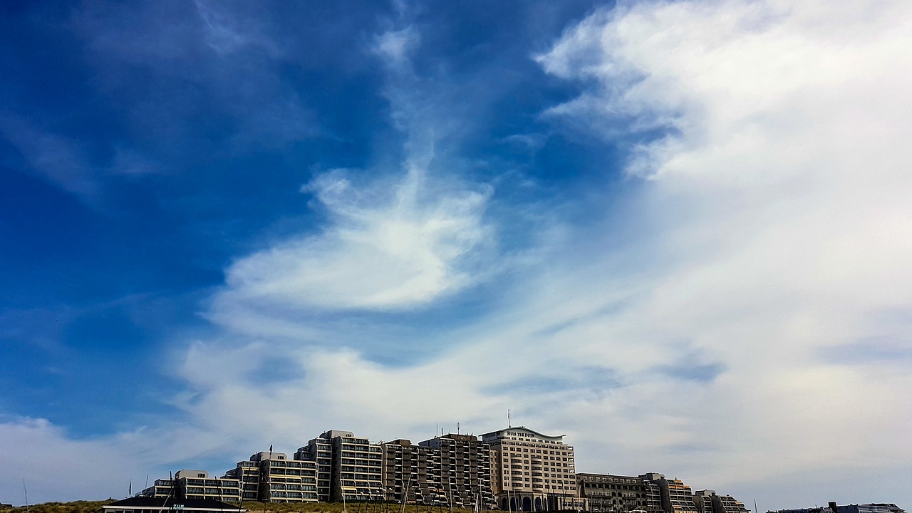 hotel complex clouds sky free photo