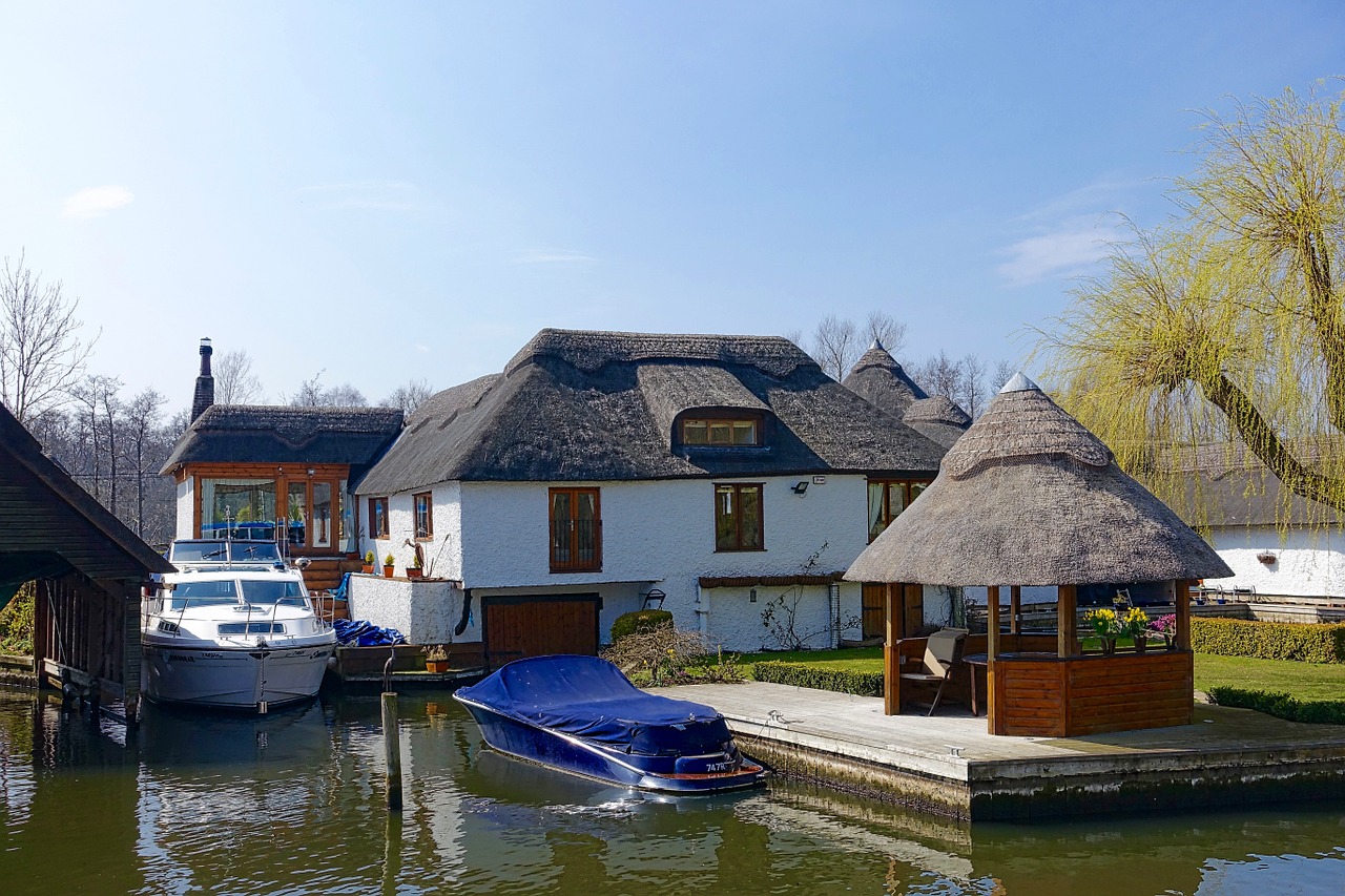 house thatched canal free photo