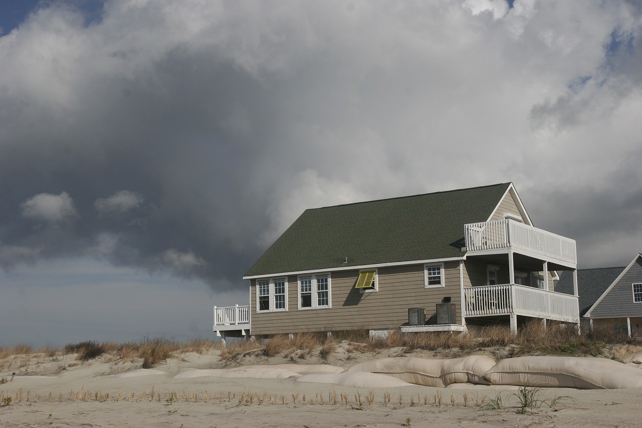 house  beach  cloud free photo