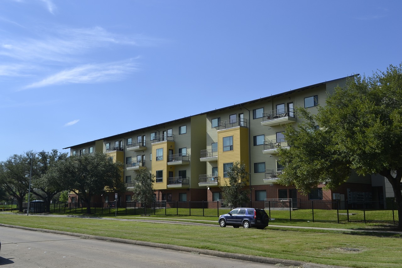 houston texas apartment complex grass blue sky free photo