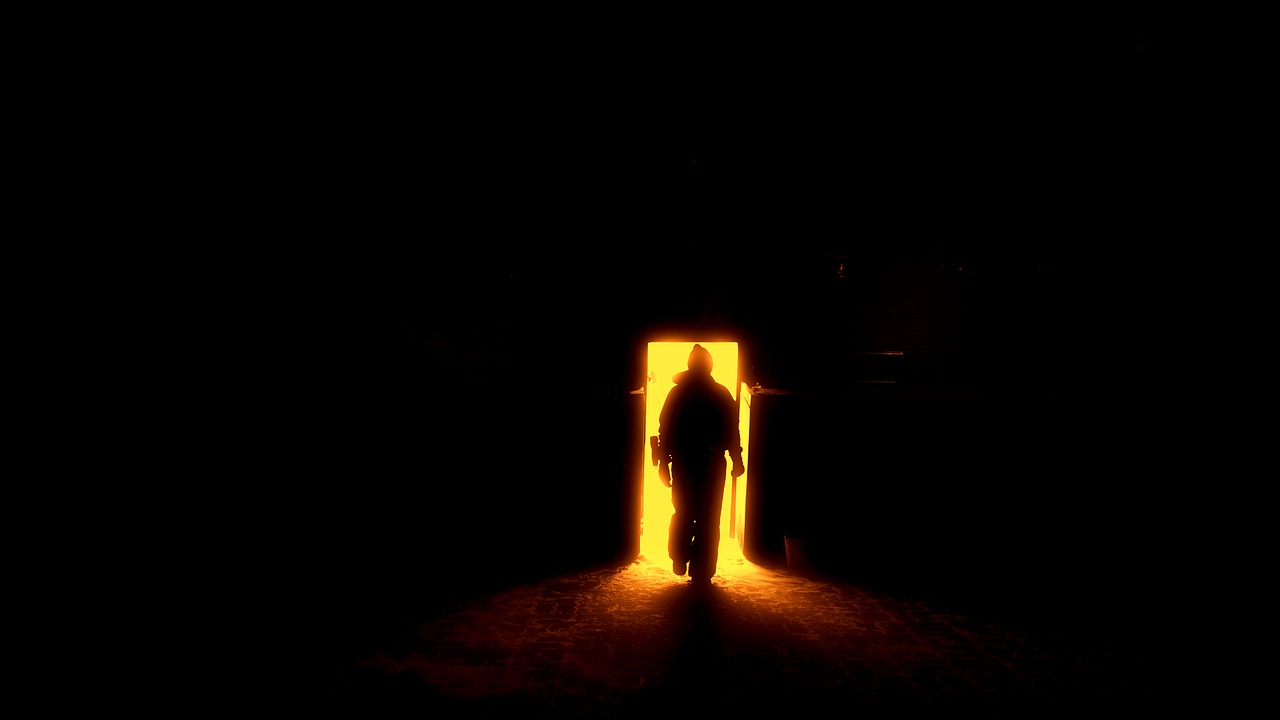human silhouette the door to hell gates free photo