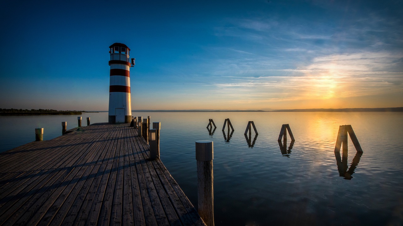 in the evening  sunset  lighthouse free photo