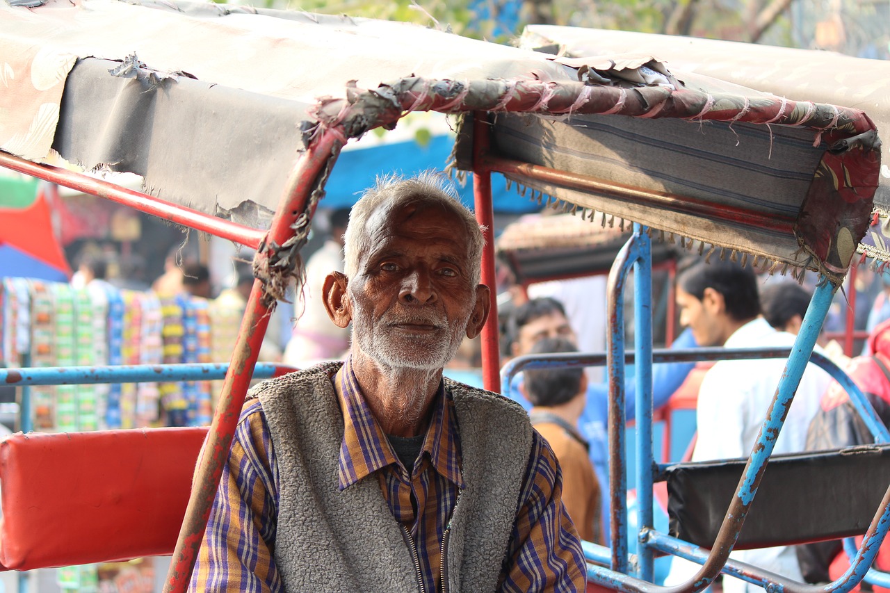indian old man rickshaw puller free photo
