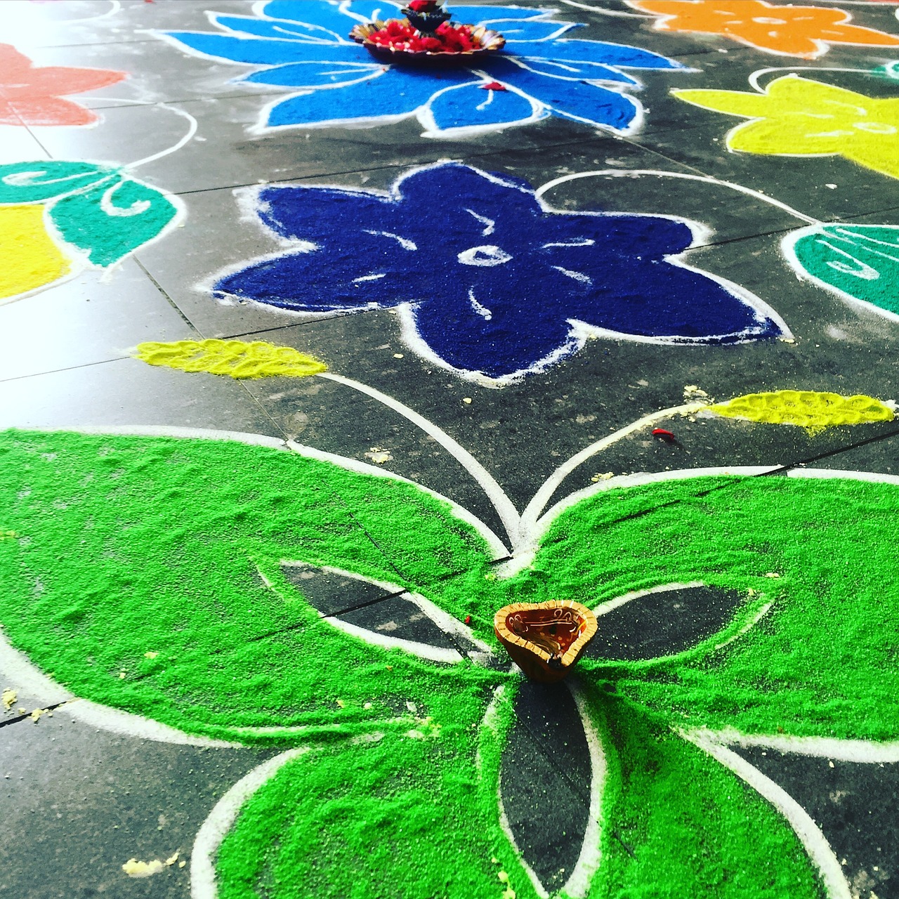 indian sand drawing green flowers free photo