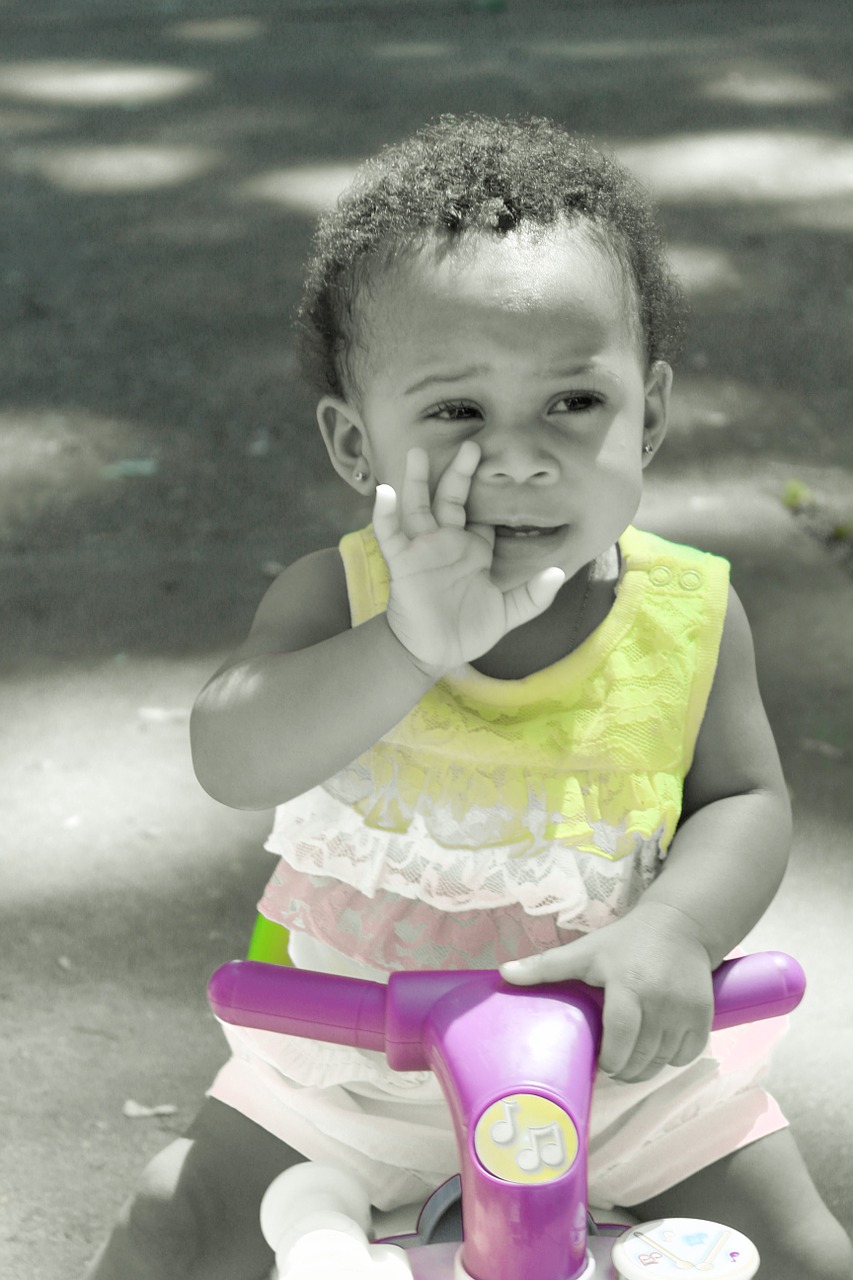 infant play riding bike free photo