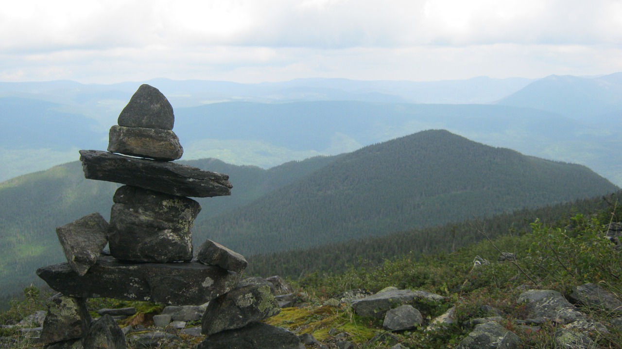 inukshuk mountain nature free photo