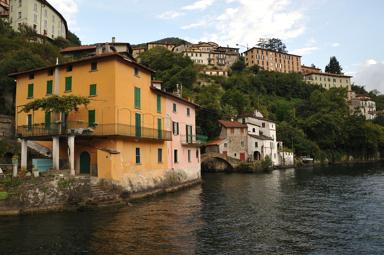 italy mountain lake house on the shore free photo