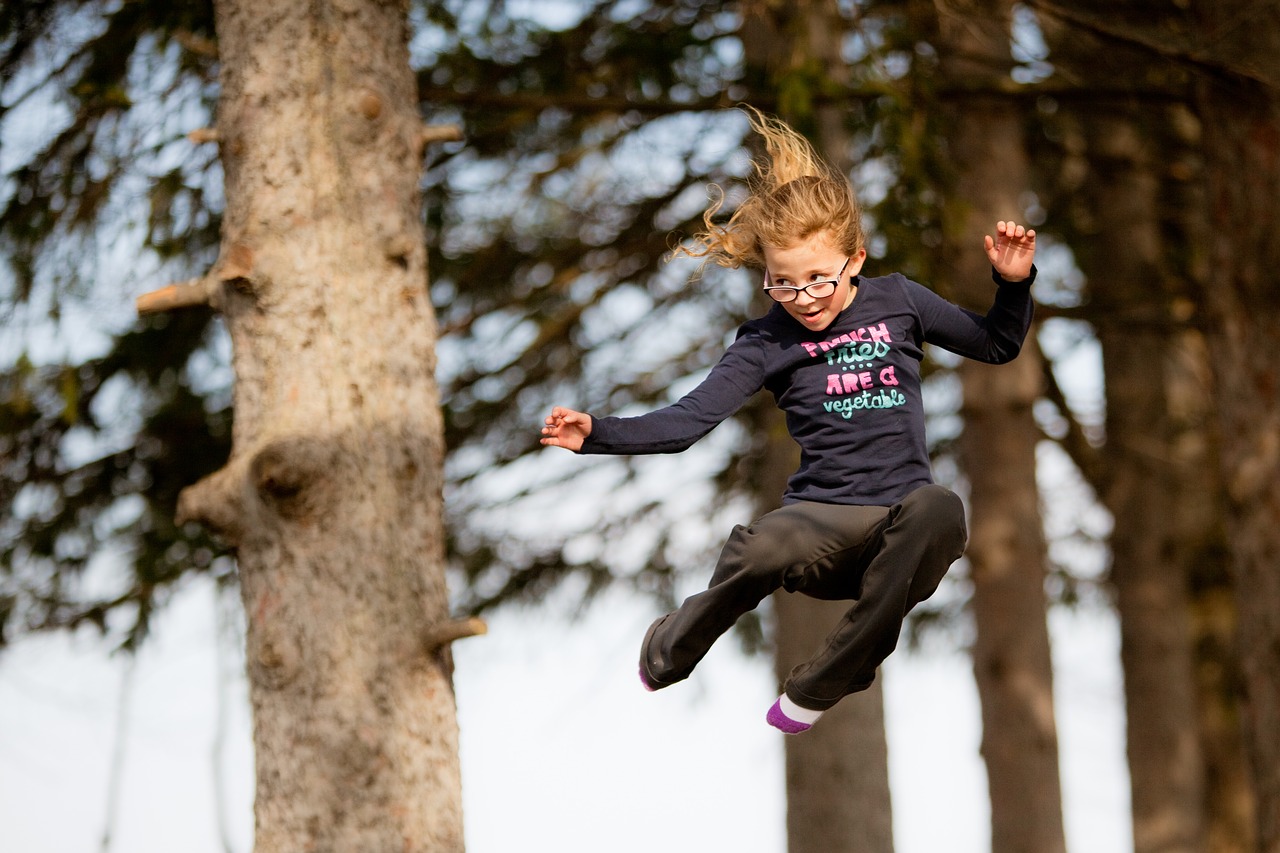 jumping young girl trampoline free photo
