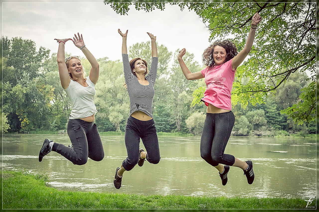 jumping happy people female free photo