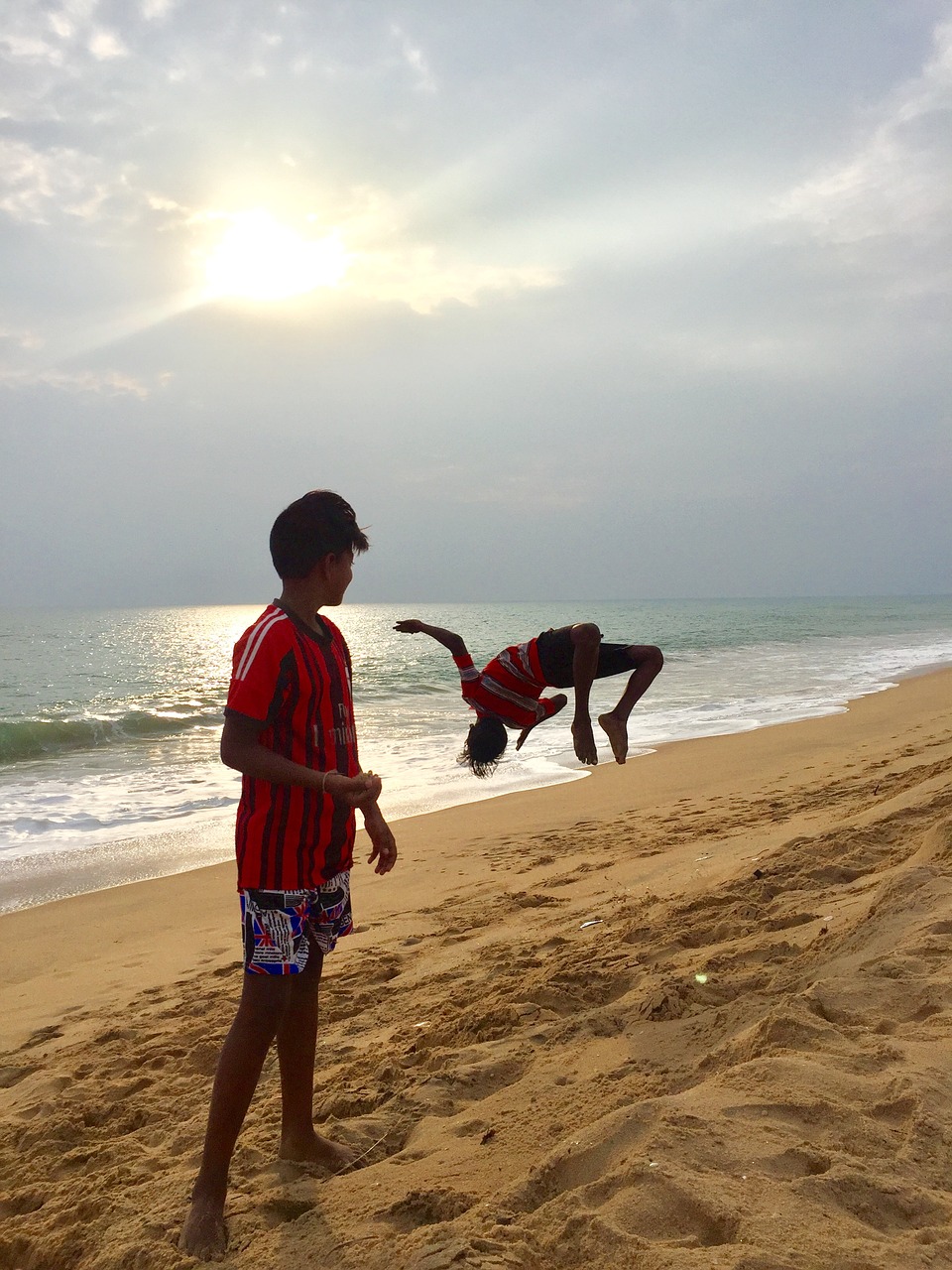 jumping for joy beach ocean free photo