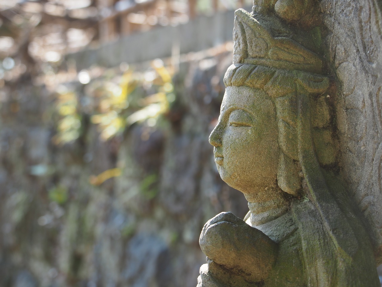 kannon profile stone statues free photo
