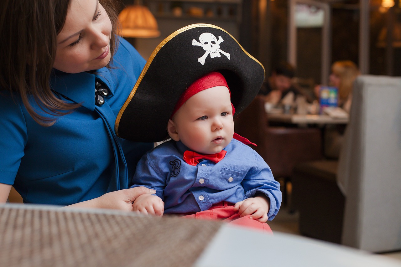 kid with mom pirate son free photo