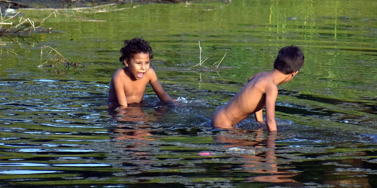 kids playing pond free photo