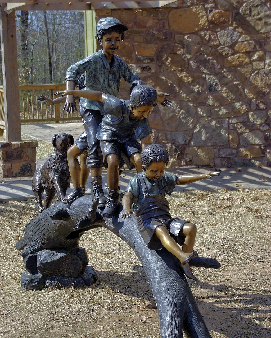 kids playing on log  sculpture  art free photo