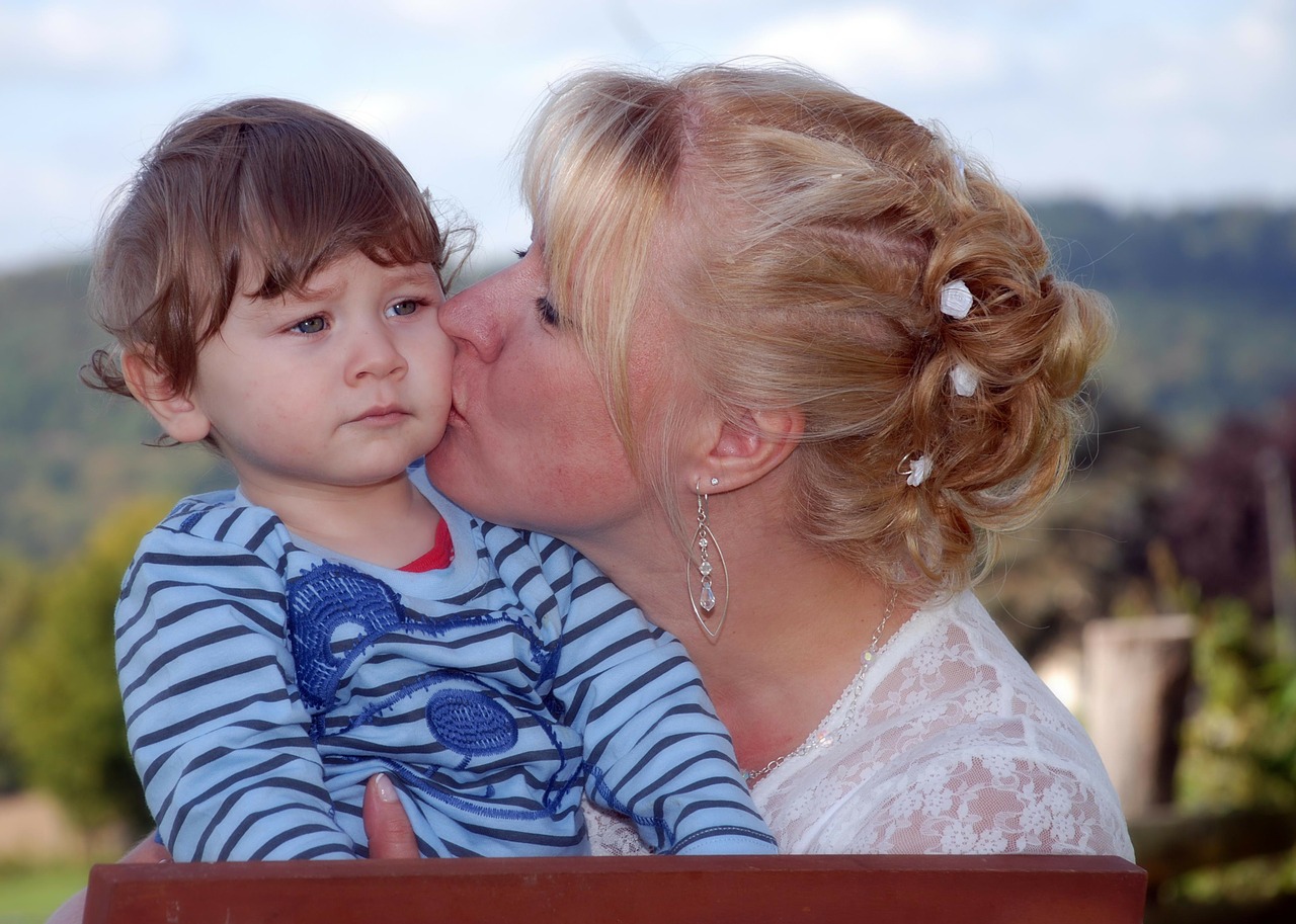 kiss mother and child affection free photo