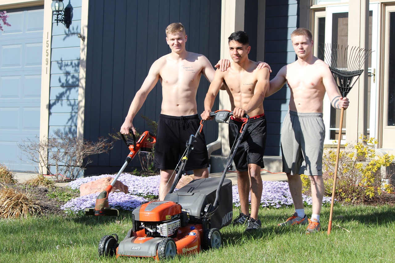lads mowing shirtless free photo
