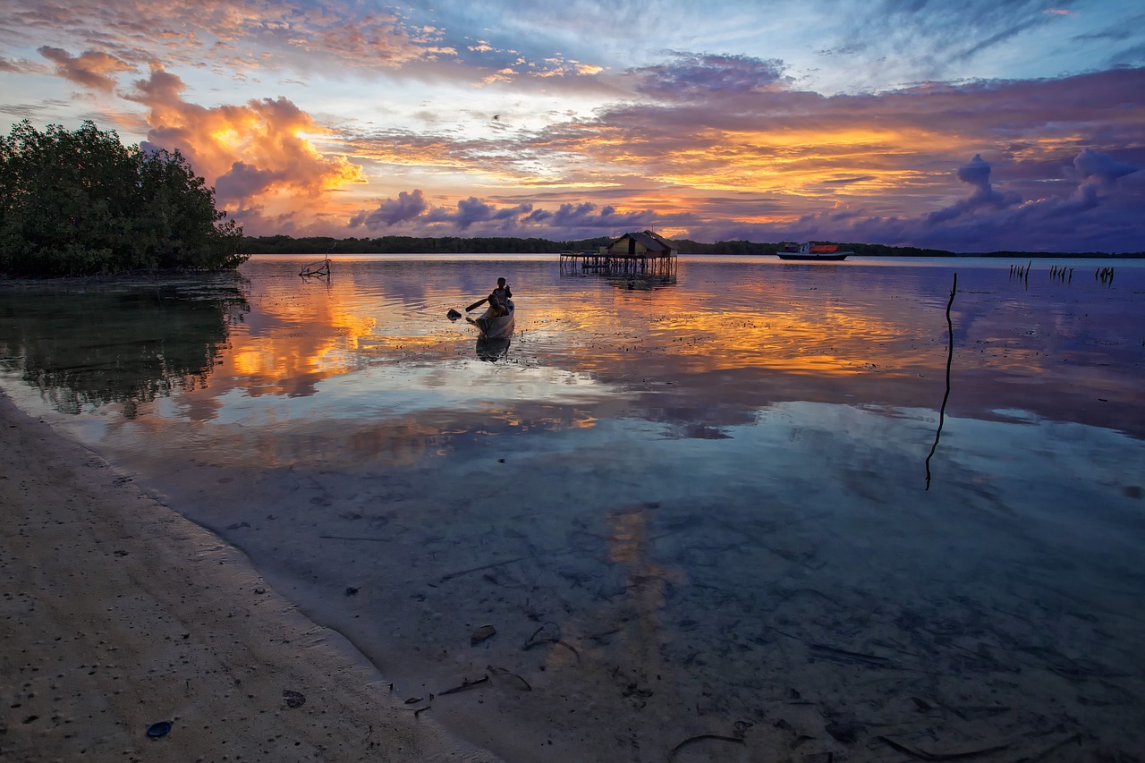 lagoon boat at dusk free photo