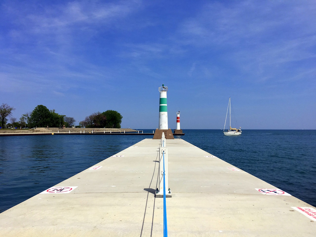 lake lighthouse sailboat free photo