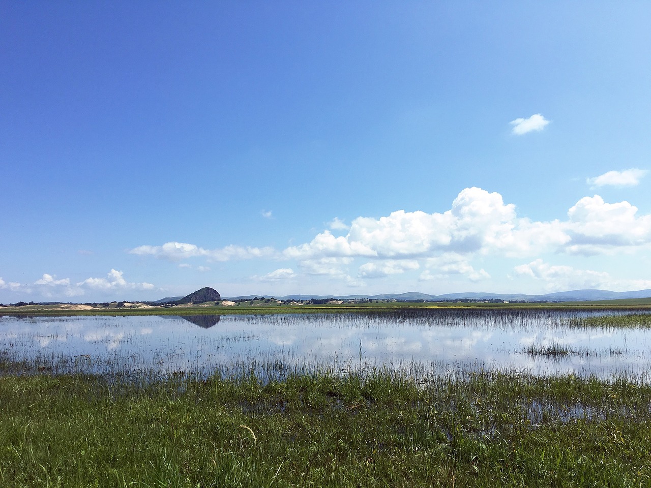 lake blue sky grassland free photo