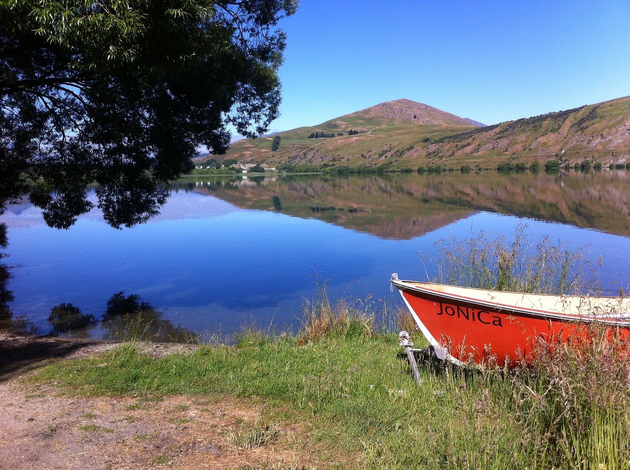 lake tranquil boat free photo