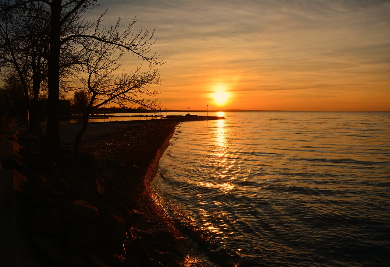 lake balaton in the evening lights free photo