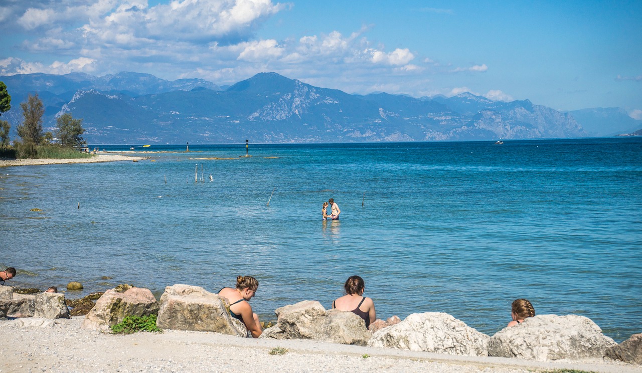 lake garda beach mountains free photo