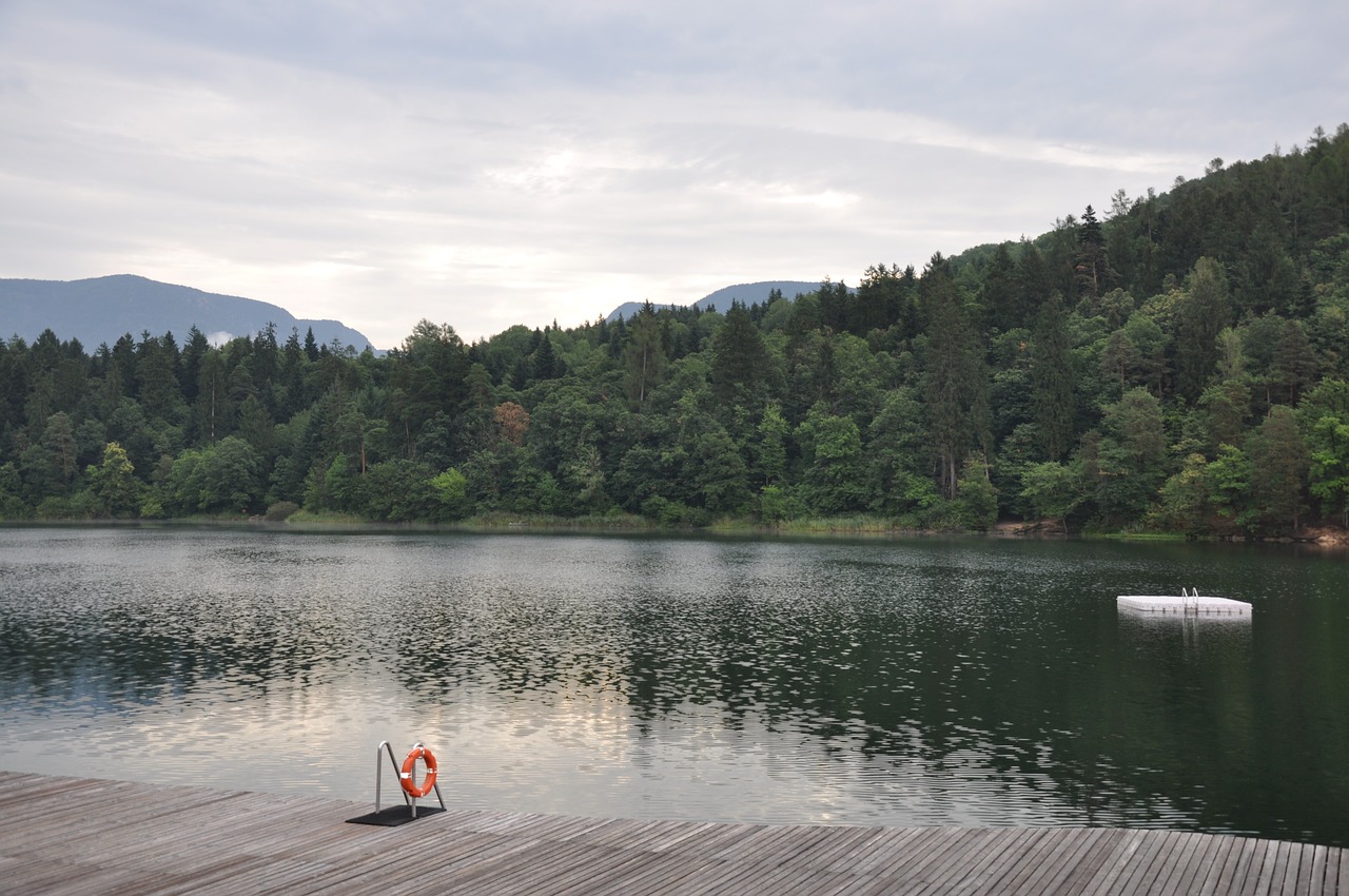 lake monticolo south tyrol clouds free photo