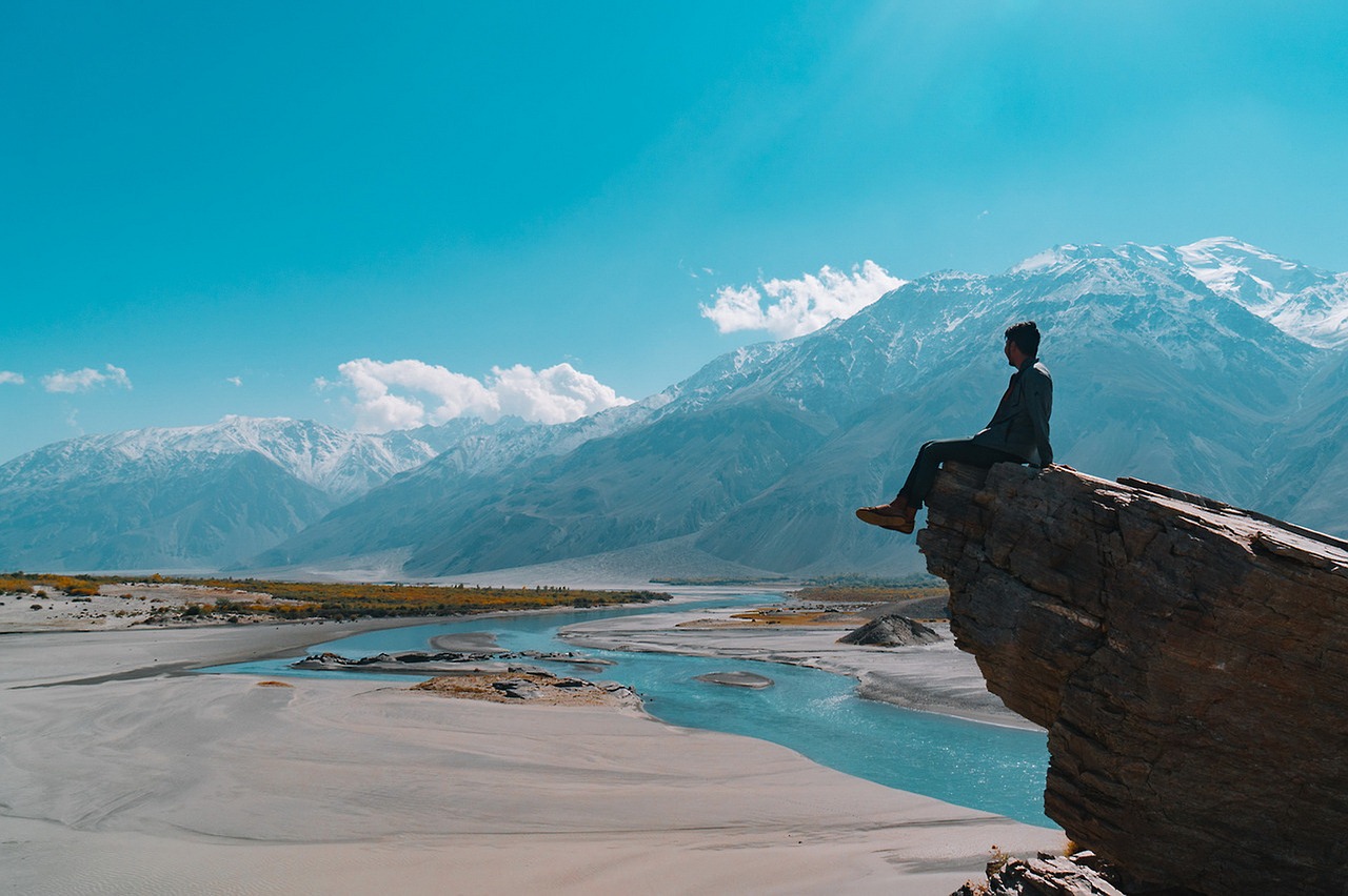 landscape sitting on the mountain happiness free photo