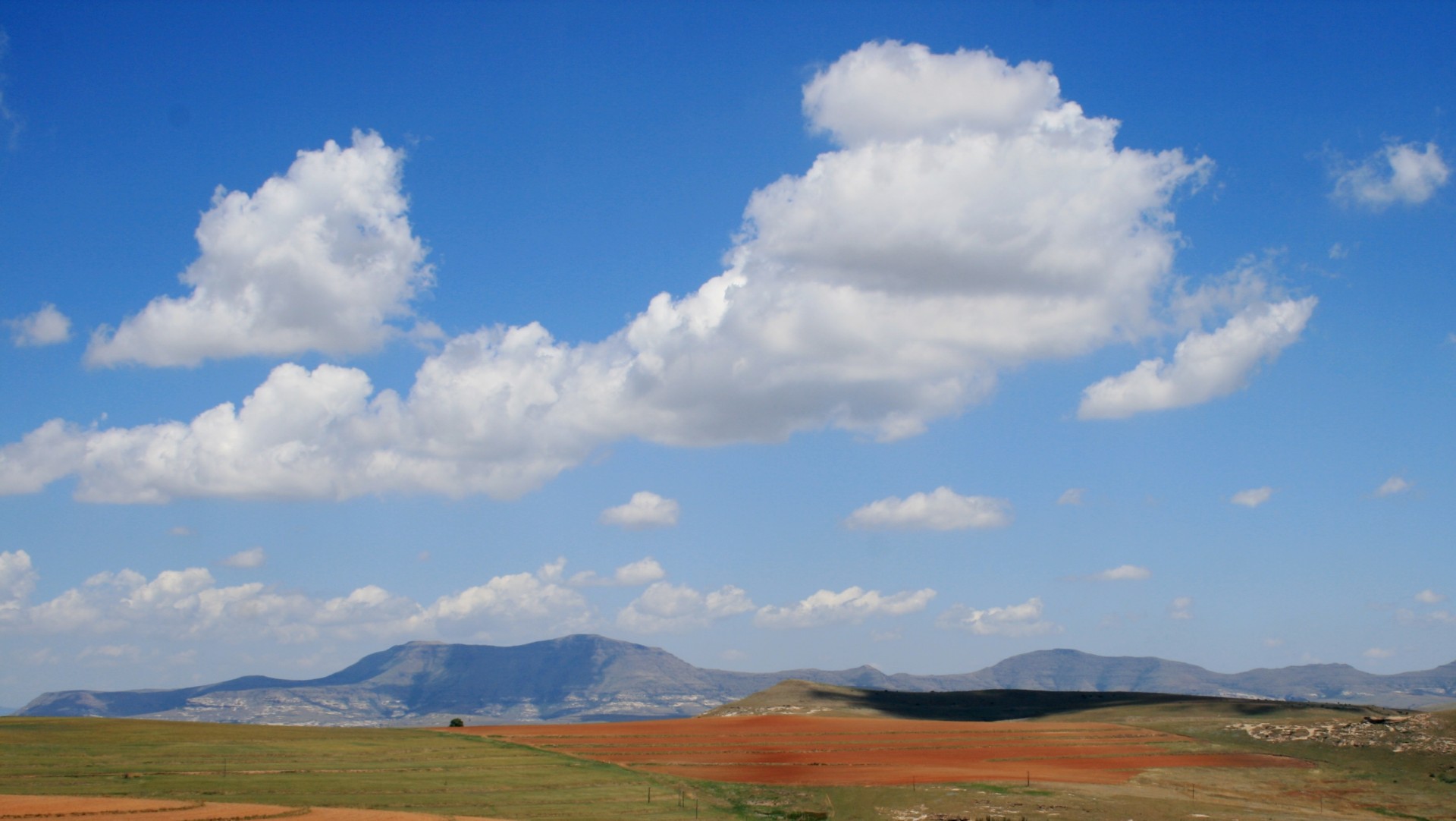 far mountains clouds blue sky free photo