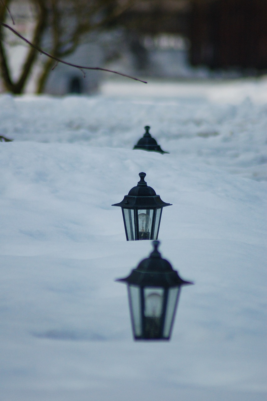 lanterns in deep snow depth of field winter landscape with lanterns free photo