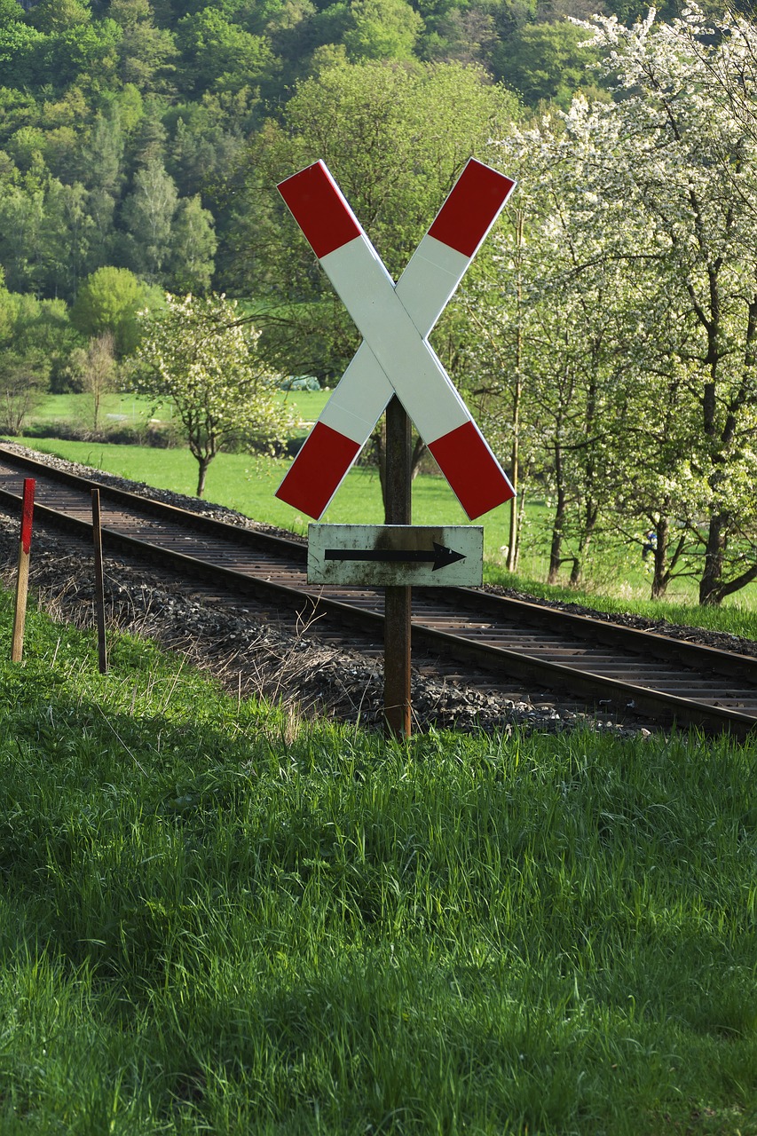 level crossing  road sign  gleise free photo