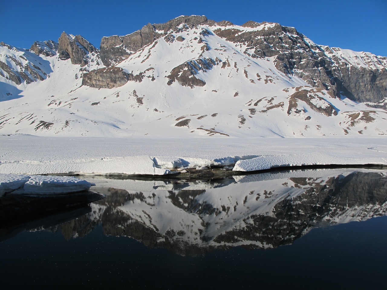 light mirroring mountain free photo