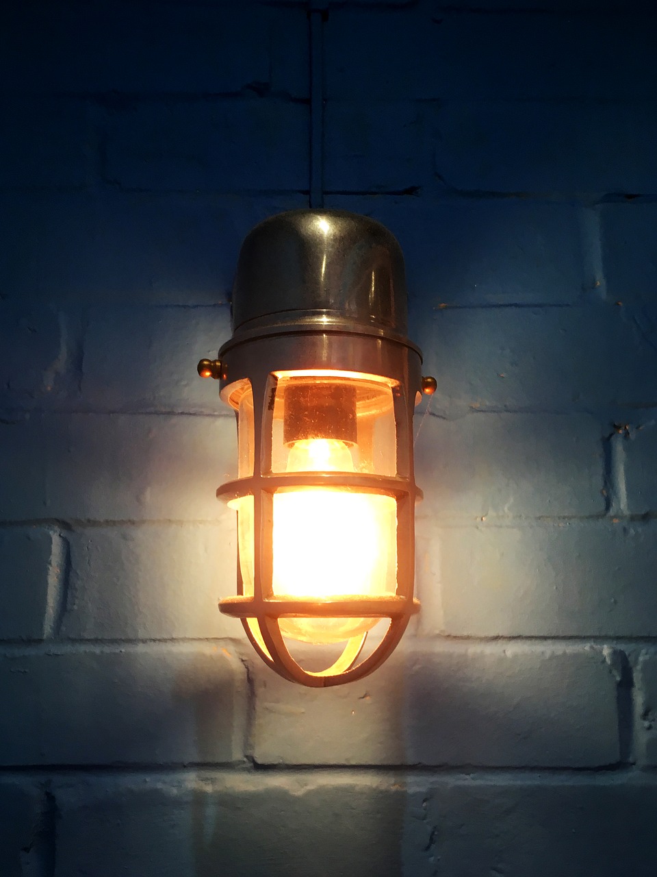 light bulb lamp blue wall free photo