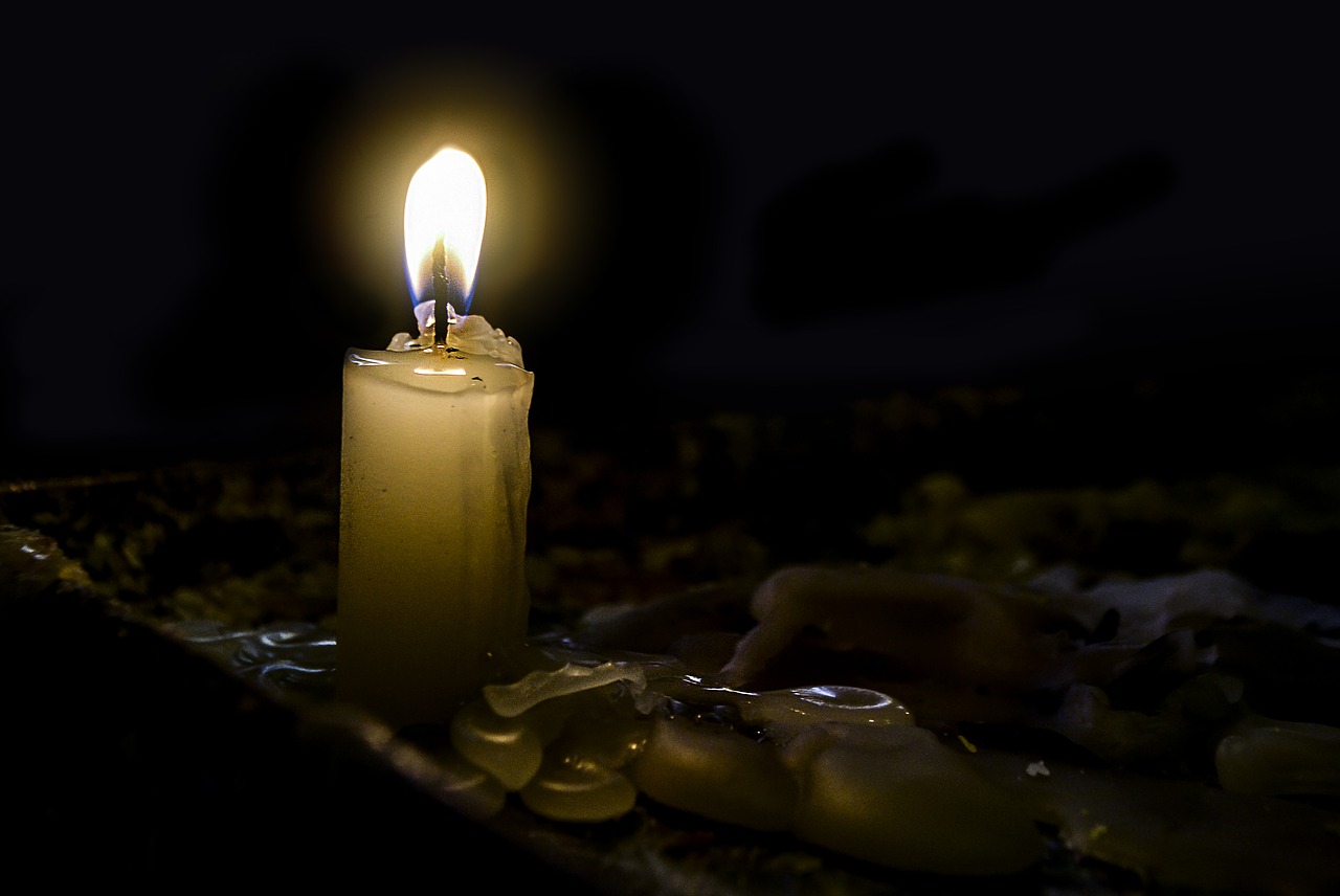 light of a candle darkness flame free photo