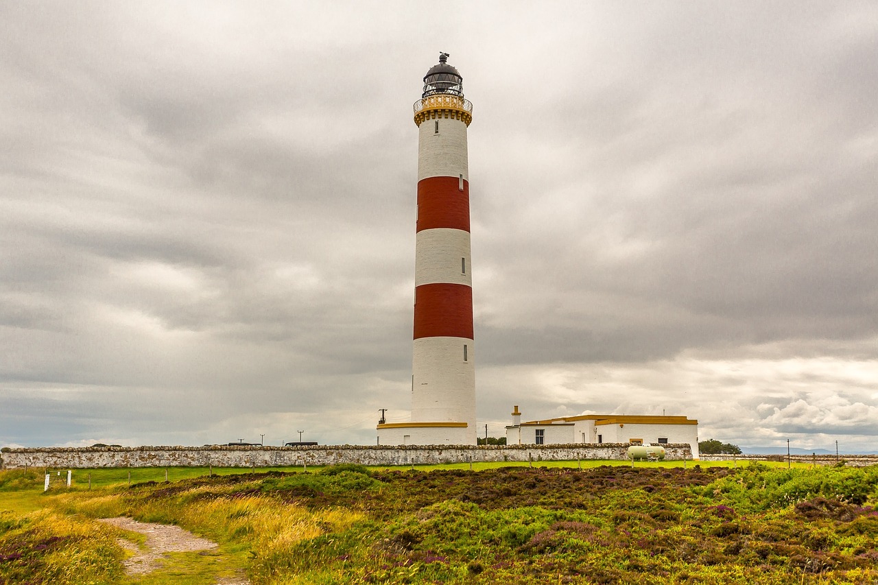 lighthouse ocean clouds free photo