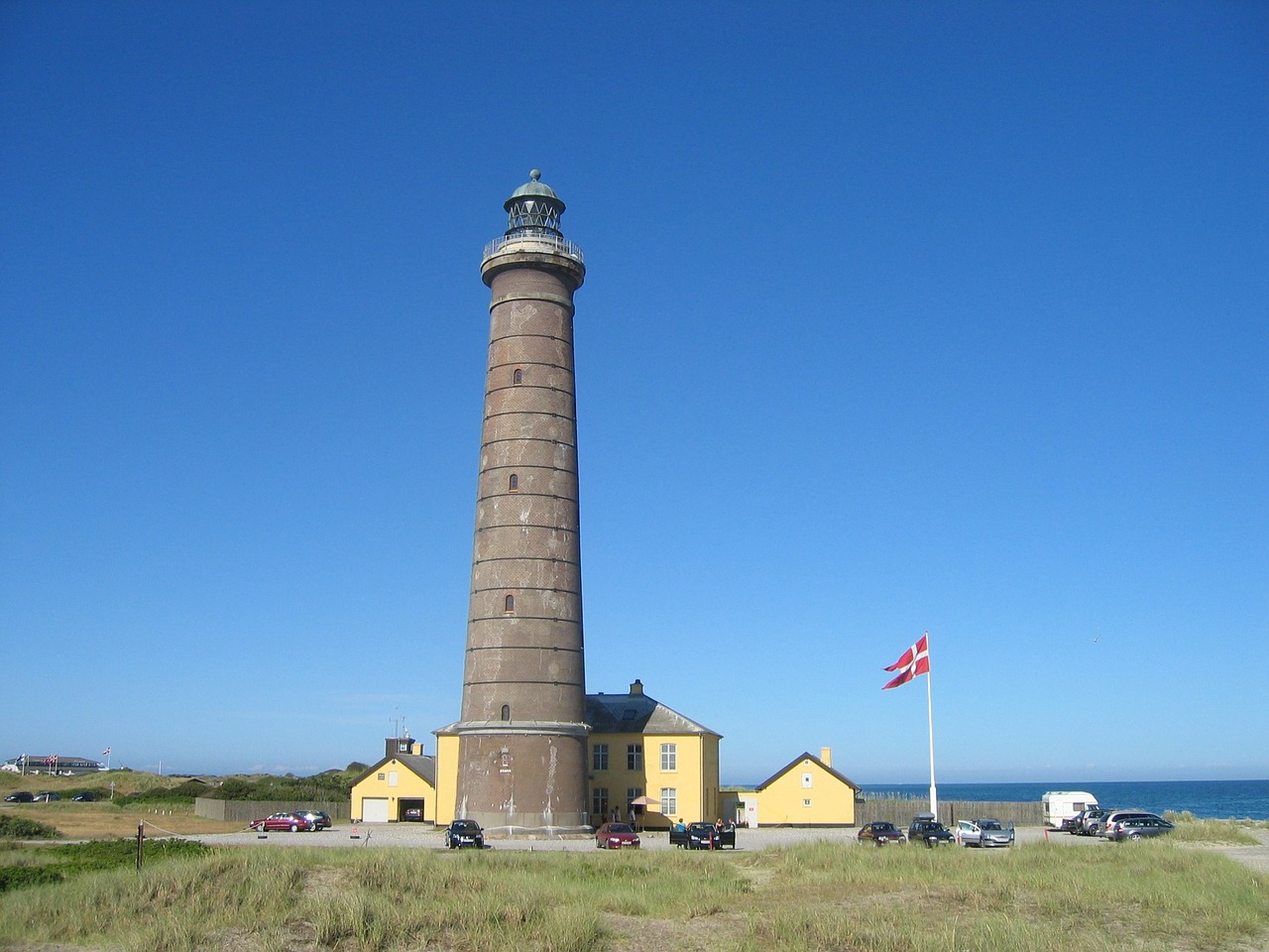 lighthouse house beach free photo