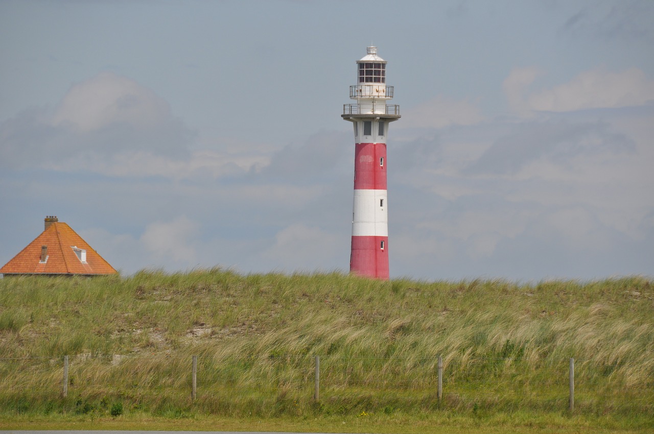 lighthouse at the seaside holiday free photo