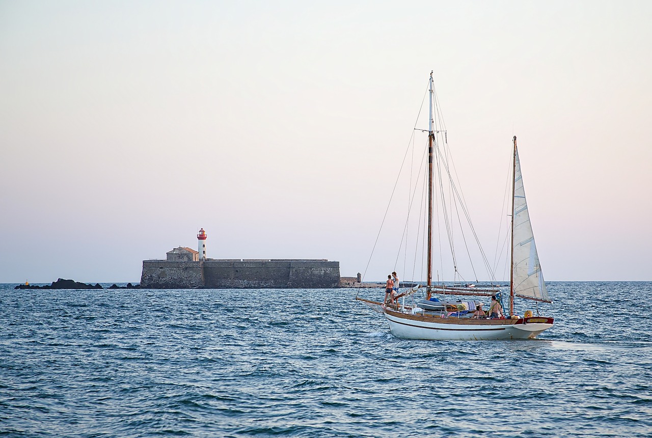 lighthouse sailboat sea free photo