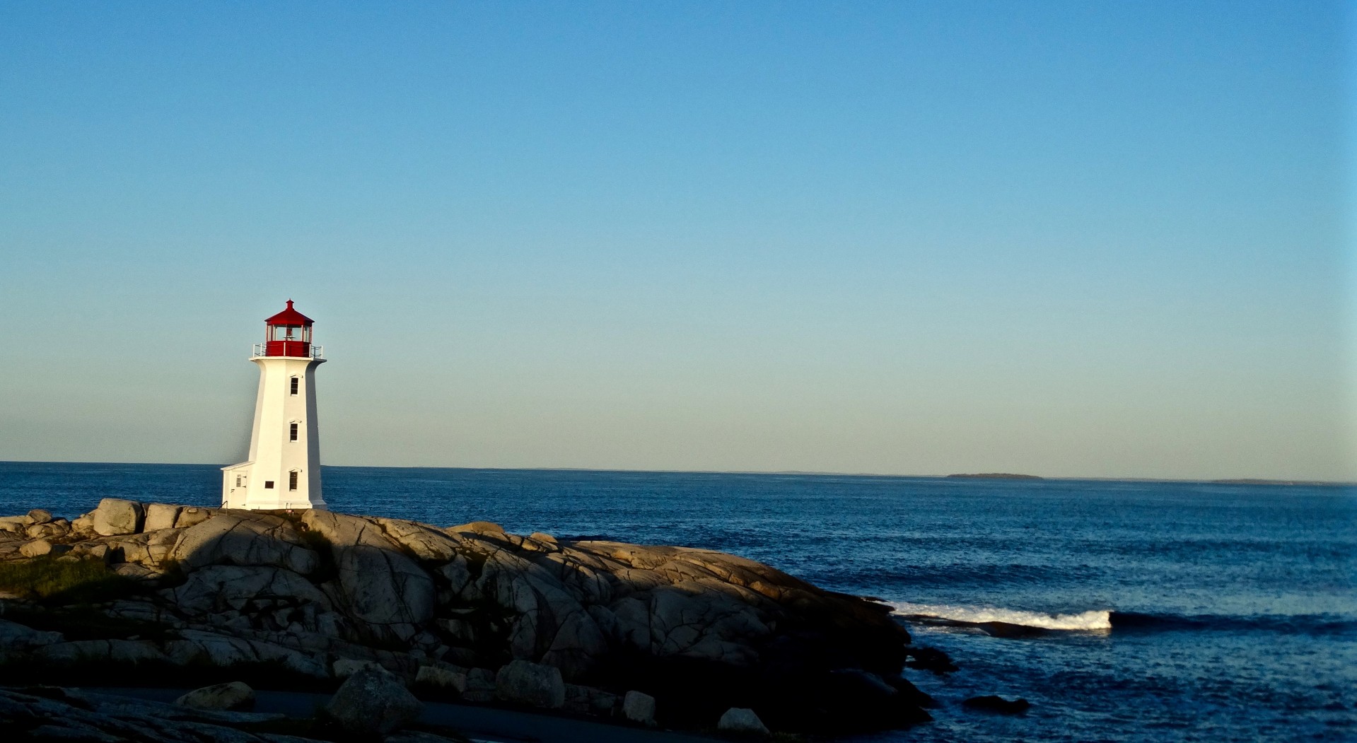 blue water lighthouse rocks lighthouse free photo