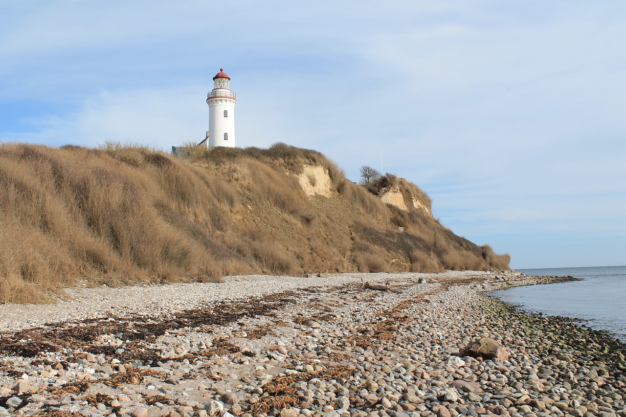 lighthouse coast beach free photo