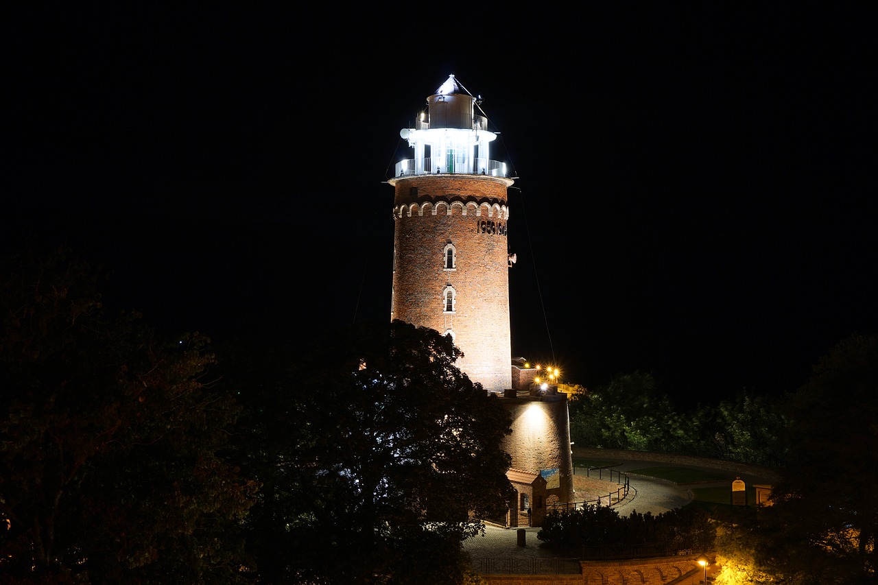 lighthouse kołobrzeg at night free photo