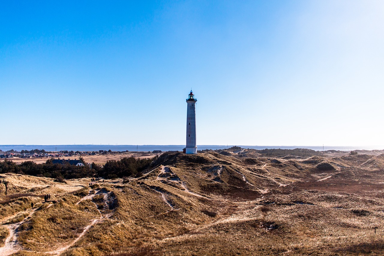 lighthouse blue sky coast free photo