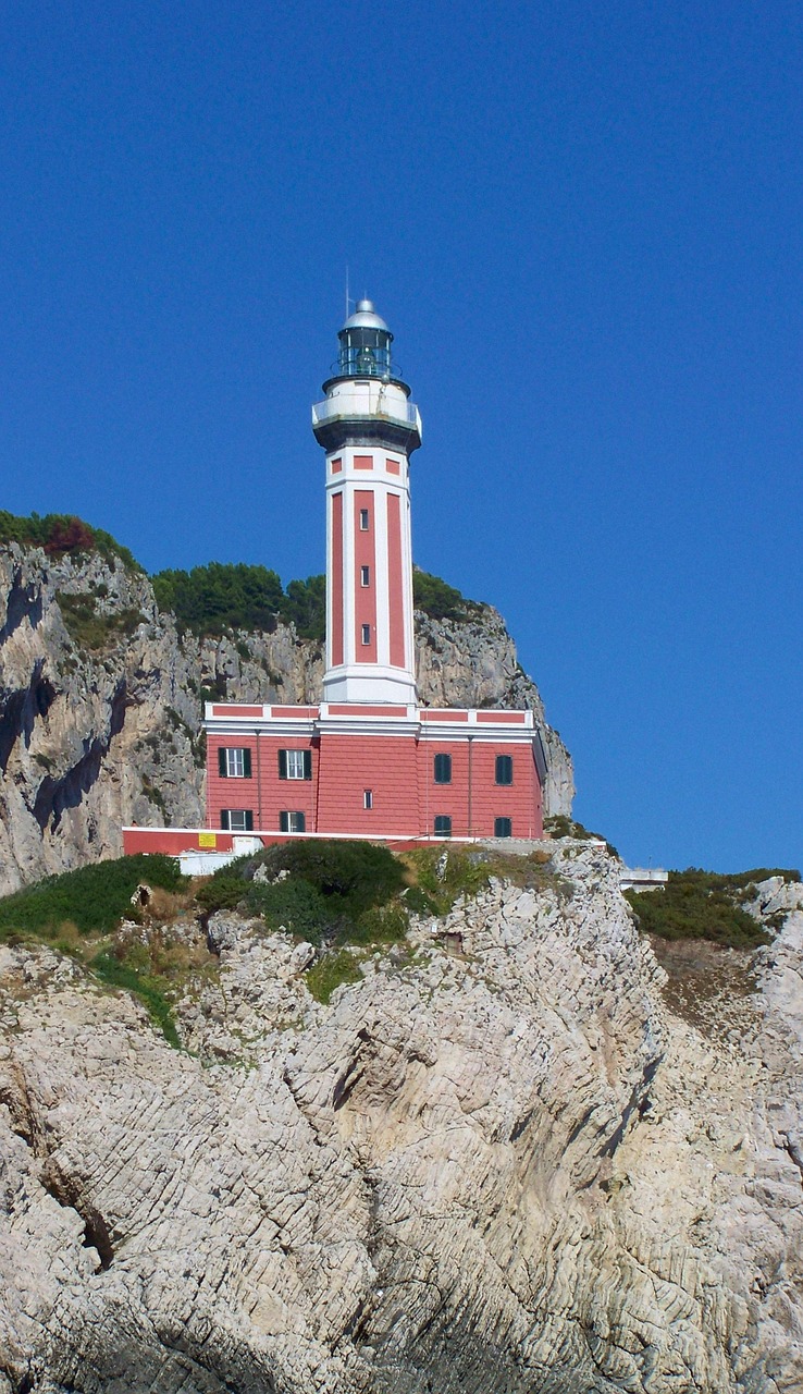 lighthouse rock sky free photo