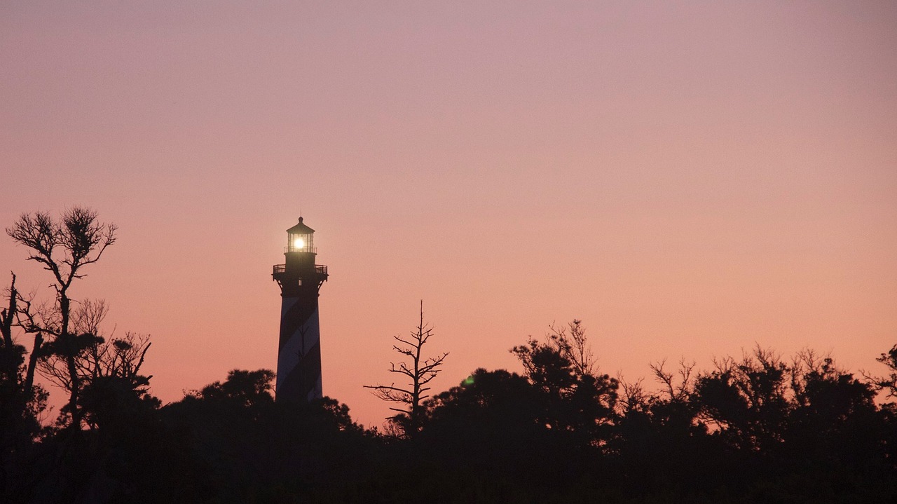 lighthouse sunset evening free photo