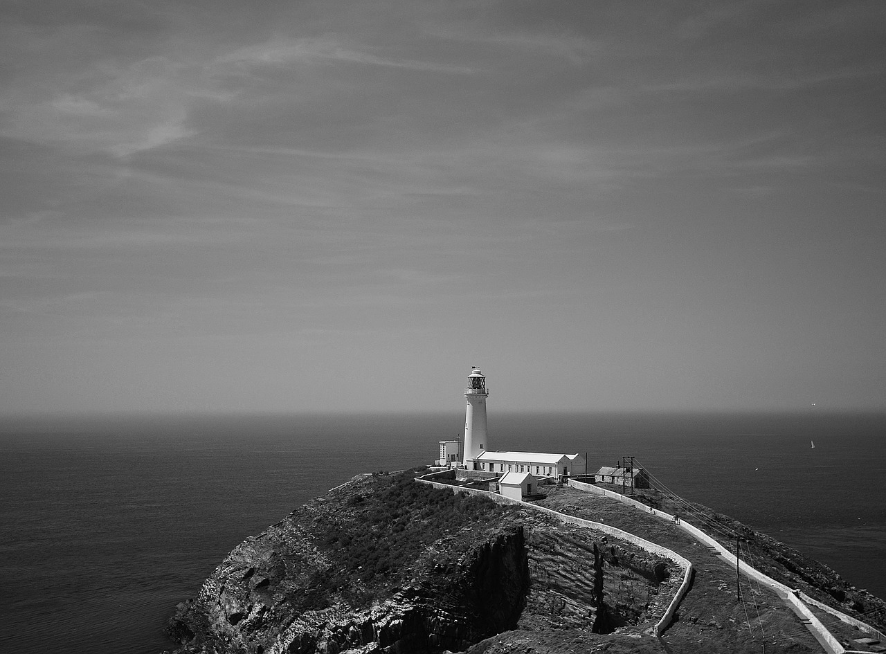lighthouse cliffs sea free photo